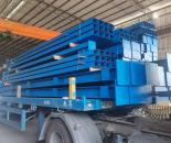 Dark-blue painted steel members on a transport vehicle
