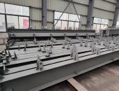 Grey painted steel members stored in a workshop