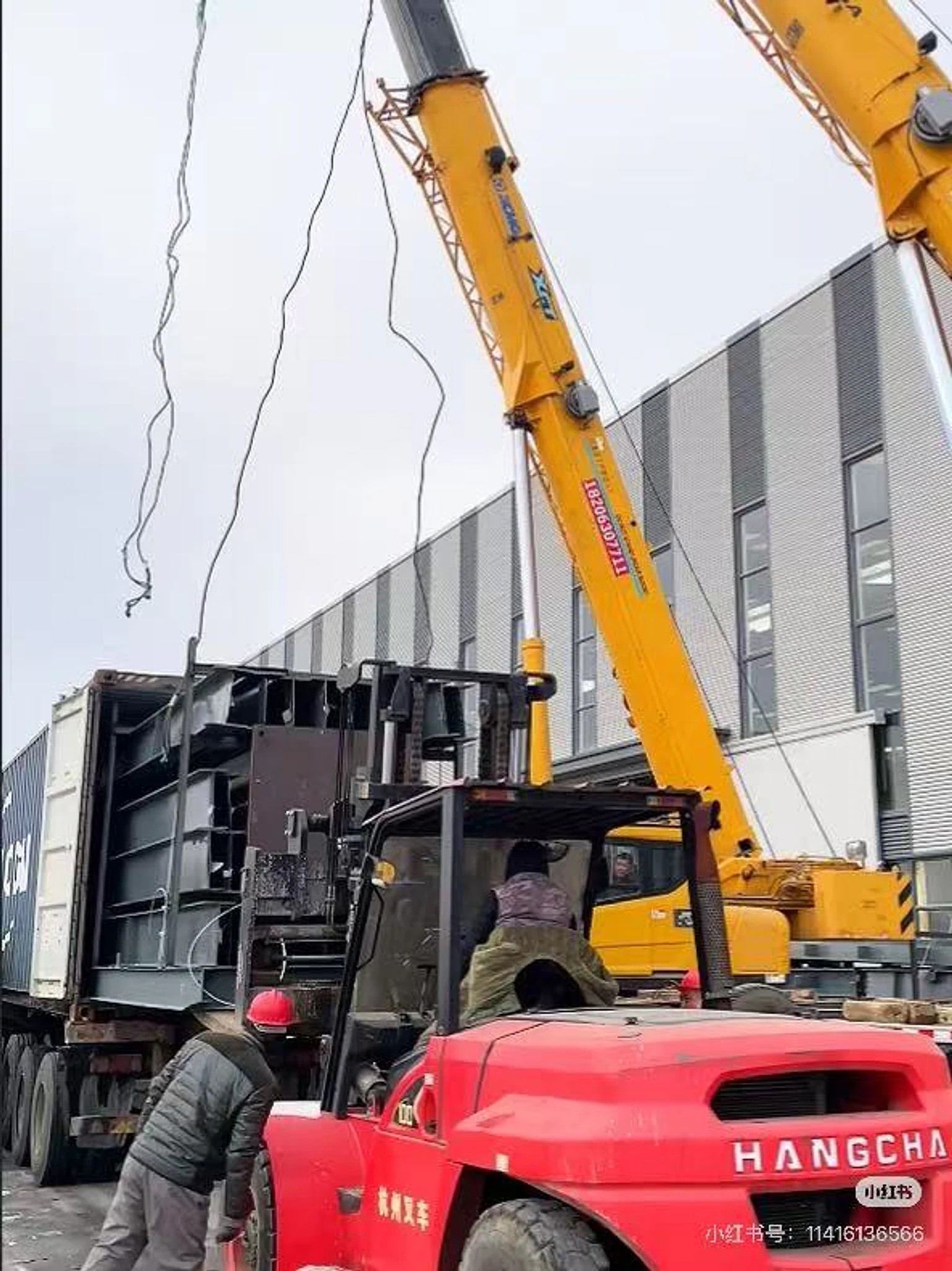 Forklift and crane handling a steel component rack
