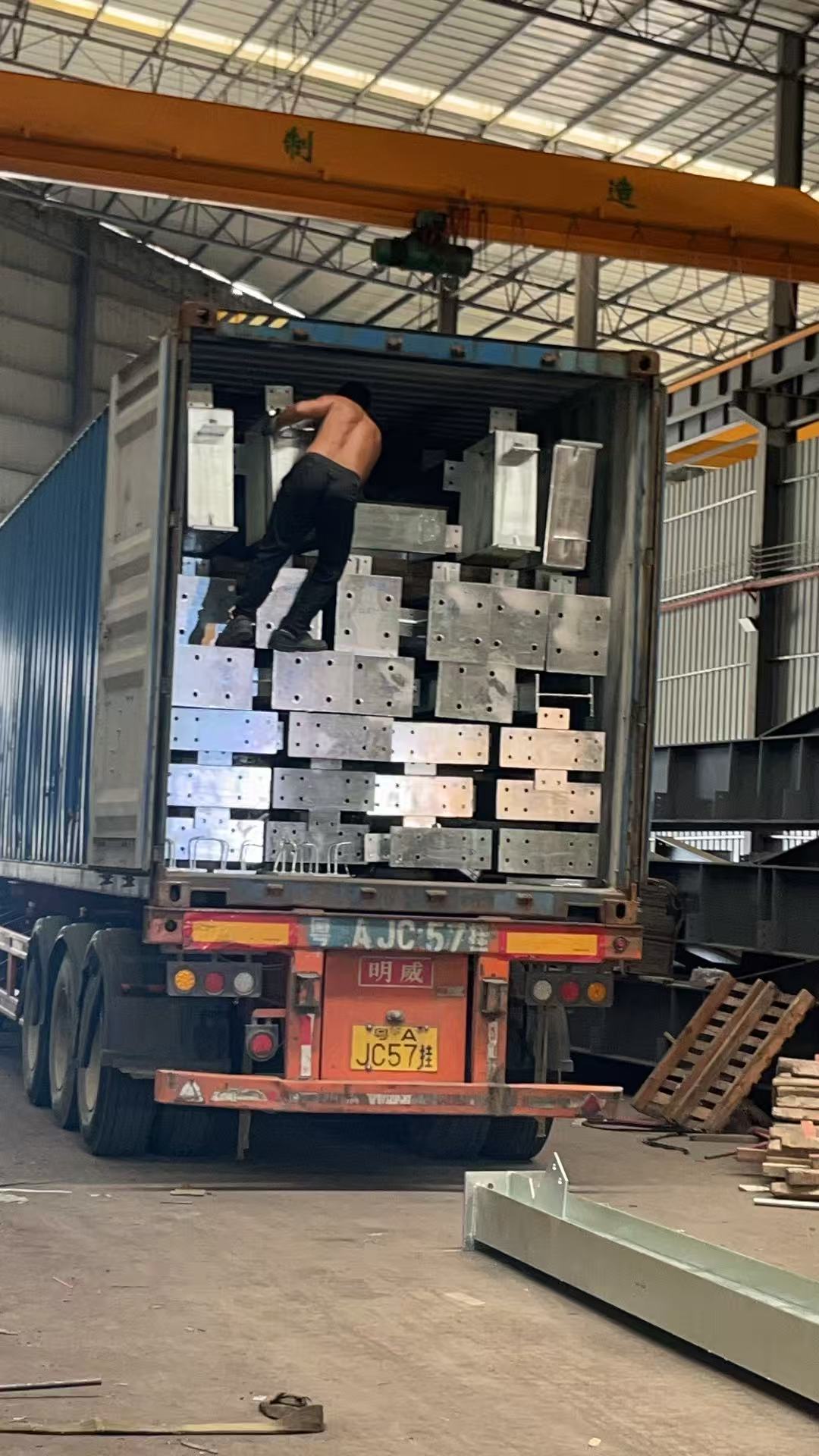 Steel structure components being loaded into a container for the Djibouti project