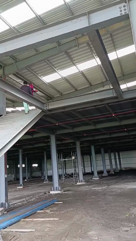 Second stair and platform view inside a steel warehouse project in the Philippines