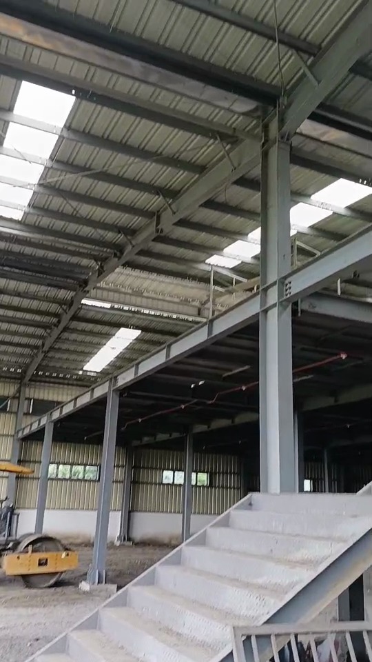 Interior project progress with steel framing and site equipment visible in a Philippines warehouse