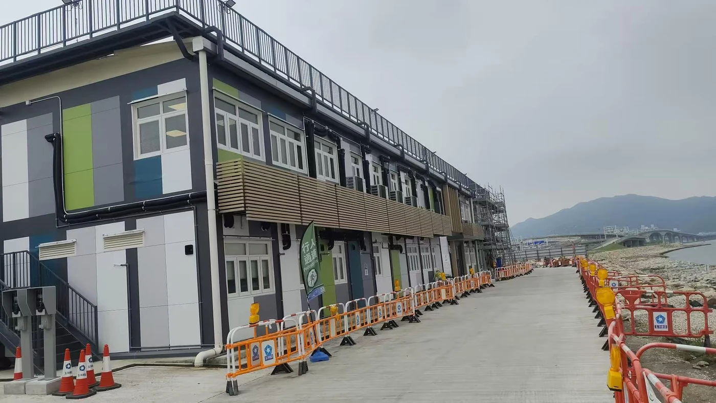 Two-storey steel structure office building with exterior stair and site access route