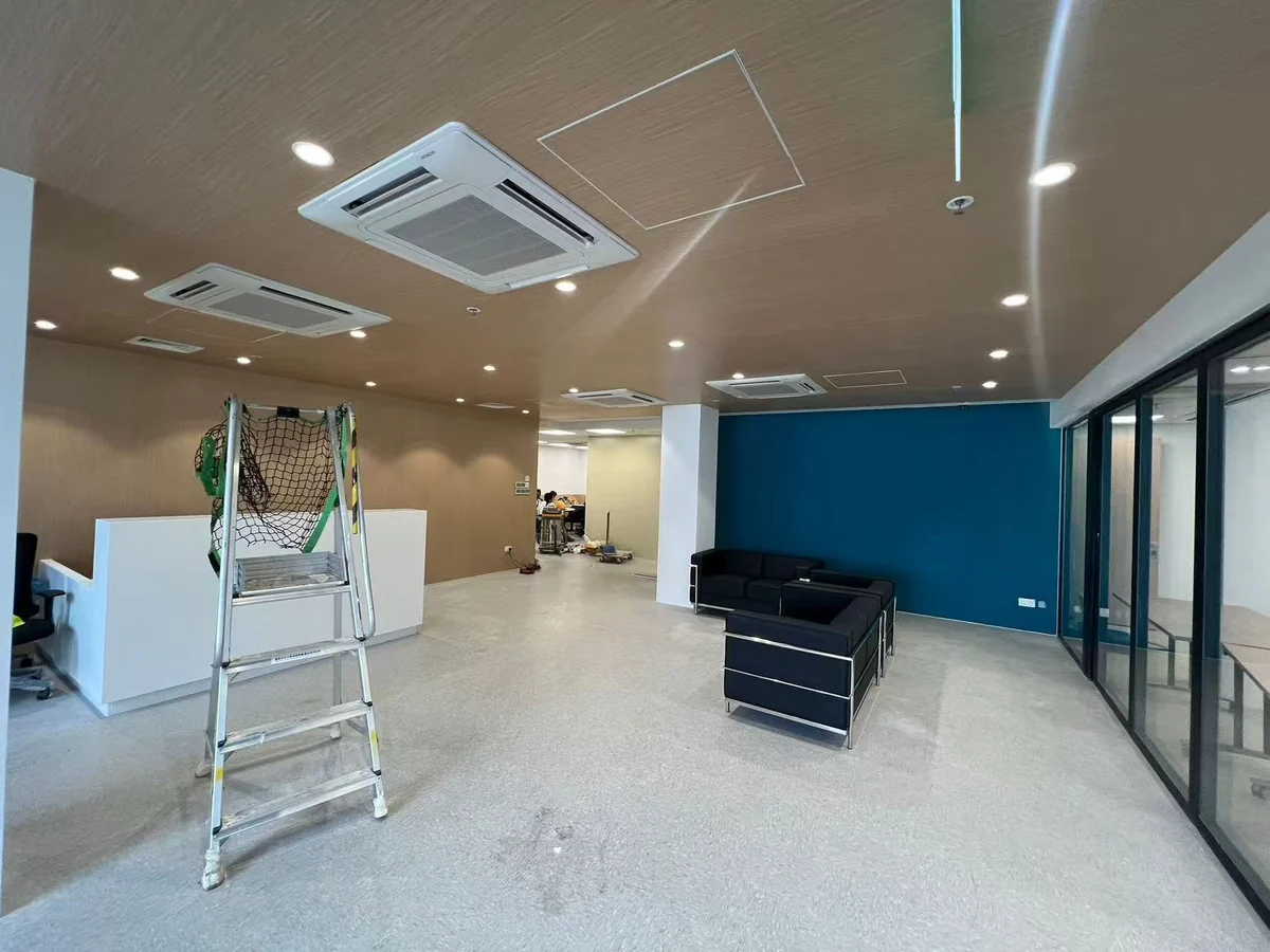 Lounge and glass partitioned rooms inside the airport-site office building