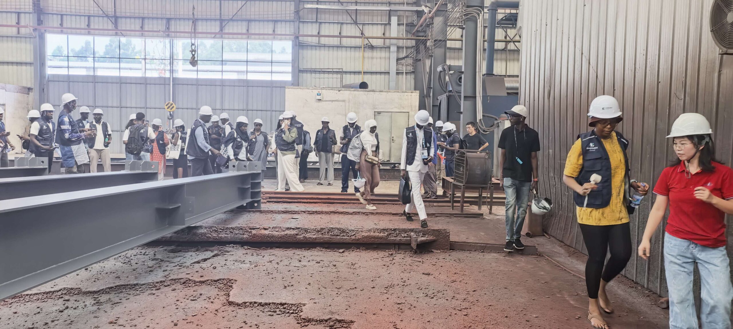 The visitor group touring Ganyo’s steel structure production workshop.