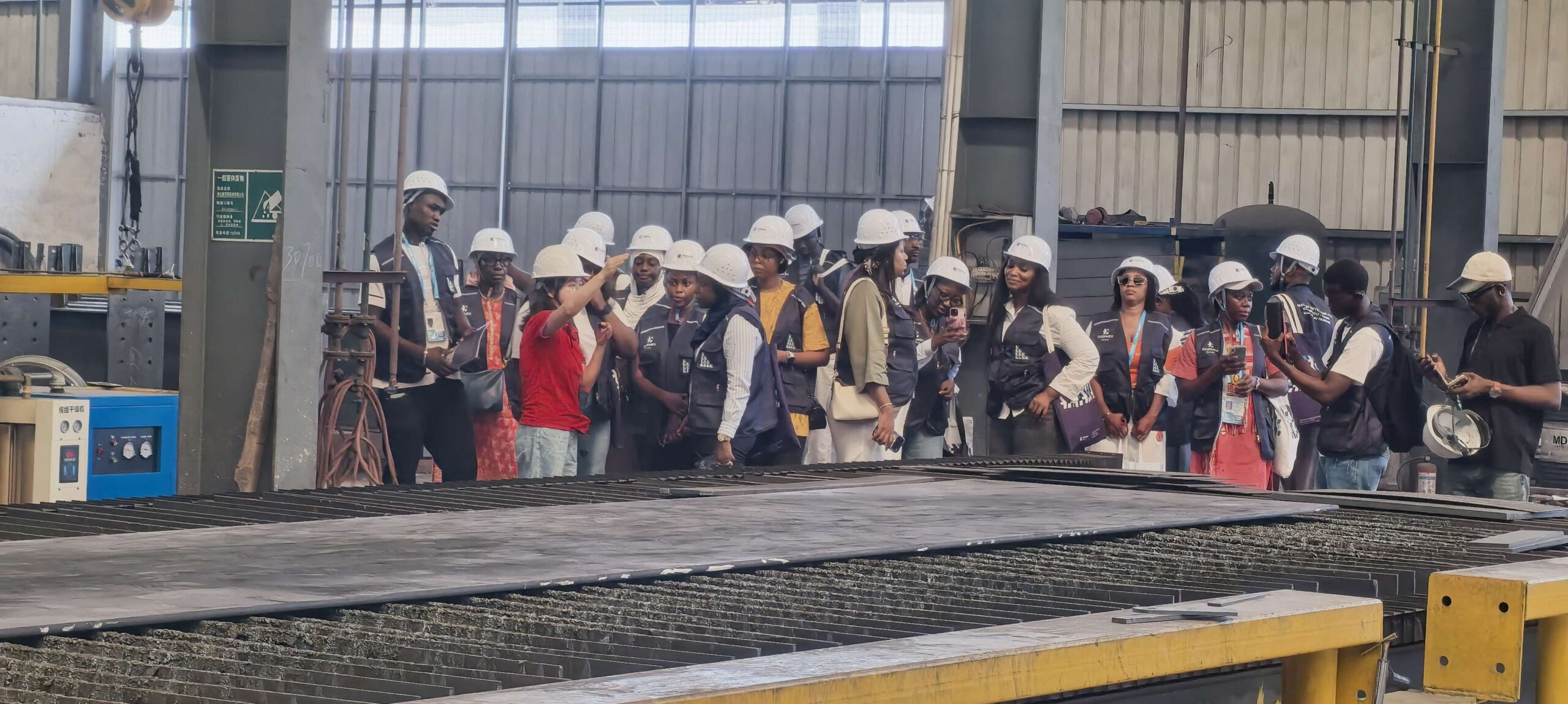 Visitors from Senegal during a steel structure workshop tour at Ganyo.